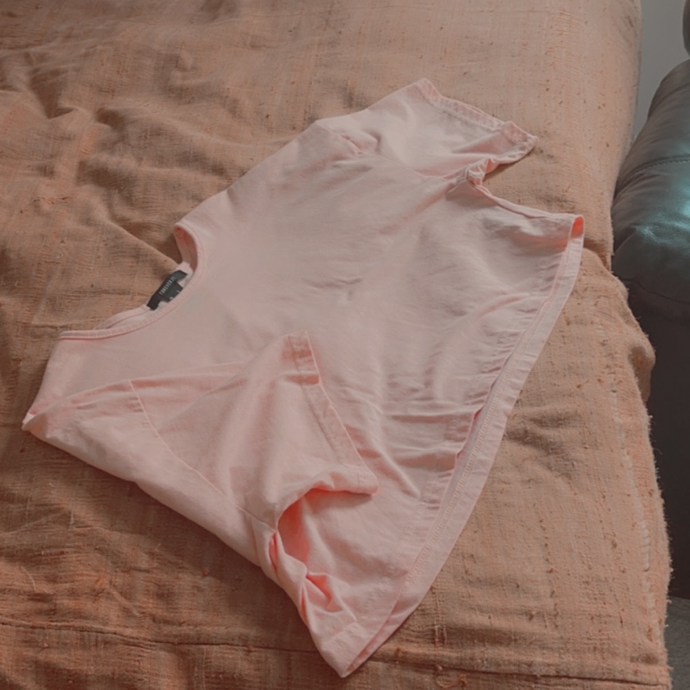 loose-fitted pink t-shirt crop top